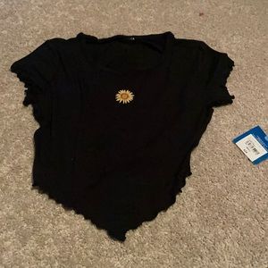 Black sunflower shirt.